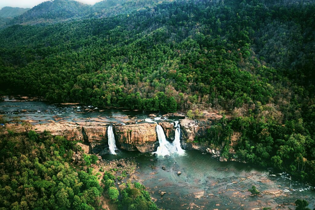 Athirappilly waterfalls surrounded by lush forest Kerala